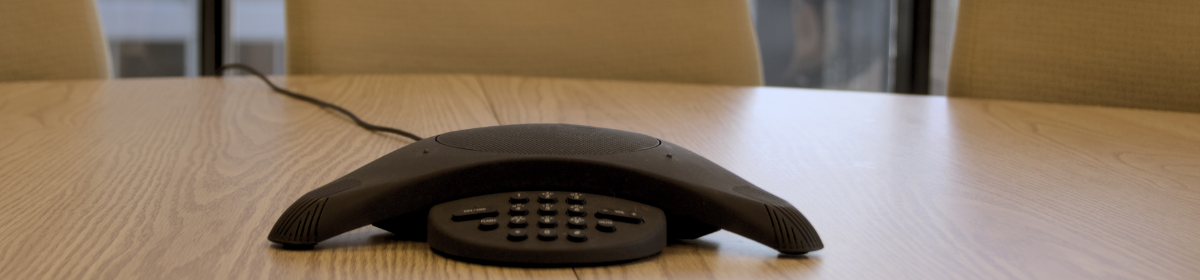 polycomm audio device on desk